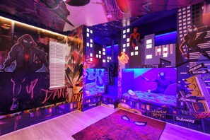 Epic superhero-themed room with vibrant cityscape, bunk beds, and neon lights!