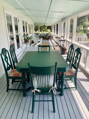 dine alfresco serenaded by birds and wind chimes .