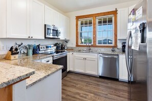 Cook up a meal for the whole family in the Kitchen with stainless steel appliances and granite countertops.