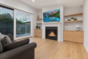 Living Area, Smart TV + Gas log fireplace