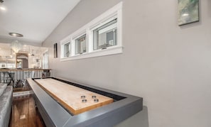 Challenge others to a game of shuffleboard.