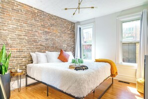 Family Retreat: This elegant bedroom is ideal for families and groups, featuring multiple beds and extra comforts like soft linens and pillows. The serene design ensures a peaceful retreat for all 