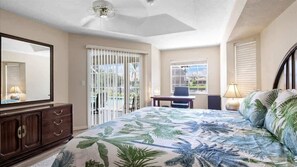 "Primary bedroom with direct access to the pool area and beautiful views."