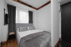Living area with double bed.