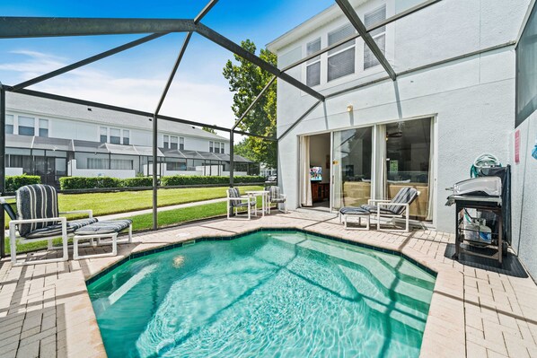 Unwind in this private pool area, perfect for a refreshing dip on a sunny day - Enjoy outdoor grilling with the convenient BBQ setup, ideal for family gatherings - Comfortable seating and a serene environment create the ultimate backyard oasis