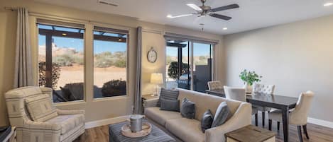 Main Living Area - The living room is conveniently adjacent to the kitchen. There is also access to the back patio which has a BBQ grille suitable for all your favorite BBQ dishes.