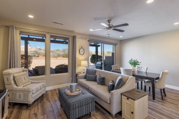 Main Living Area - The living room is conveniently adjacent to the kitchen. There is also access to the back patio which has a BBQ grille suitable for all your favorite BBQ dishes.