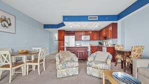 Living room with queen size sleeper sofa (sleeps 2) and access to balcony.