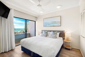 The main bedroom with king bed, tv, ensuite, wardrobe, balcony and ocean views
