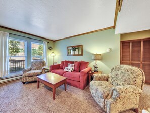View of Living Room with queen size sleeper sofa, arm chairs, coffee table, side tables and table lamps