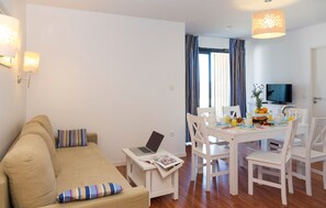 Relax after a long day on the sofas and watch the TV with your group.