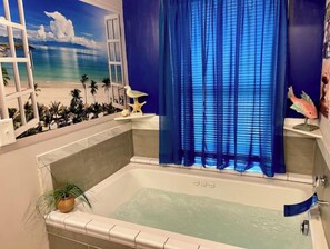 Indulge in pure bliss w/a rejuvenating spa experience in our Jacuzzi bathtub!