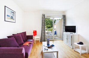 The living area is bright and warm, perfect for relaxing after a wonderful day.