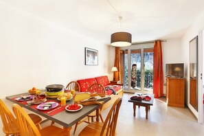 The living area is bright and cozy, perfect for relaxing after a wonderful day.