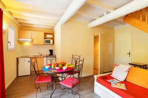 Prepare meals in the full kitchen and enjoy them at the dining table.