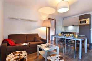 Prepare meals in the kitchenette and enjoy them at the dining table.