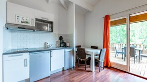 Prepare meals in the kitchenette and enjoy them at the dining table.
