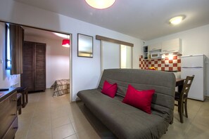 Sink into the cozy sofa after a day exploring the area.