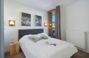 Relax on the comfy bed after a day outside.