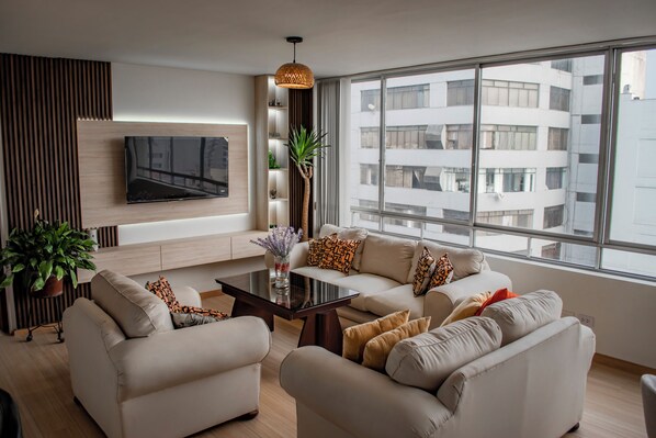 Comfy living room with lots of daylight. Great hangout spot
