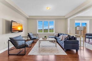 Where comfort meets entertainment. Unwind in style with our comfortable couch and catch your favorite shows on our 65-inch TV.