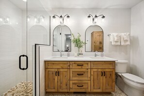 Start your day in luxury in our new main floor ensuite bath with dual sinks and walk-in tiled shower.