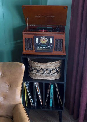 A record player awaits your arrival and invites you to enjoy a slower pace.