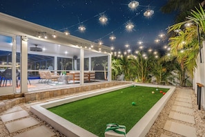 Stay, play, and unwind! Our rental with a bocce ball court is perfect for family-friendly vacations, group getaways, and outdoor fun. Enjoy lush backyard with plenty of space to relax and play. 