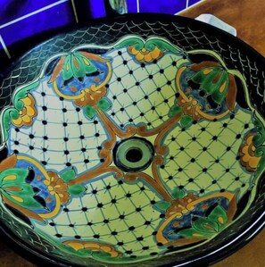 Hand painted Mexican sink in bathrooms.