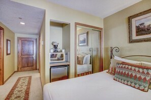 Enjoy the spacious bedroom, adorned with stylish decor, ample storage, and a king-sized bed for a restful night.