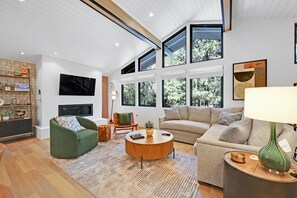 Gather in the living room to watch TV, play a board game or just stare into the fire place.