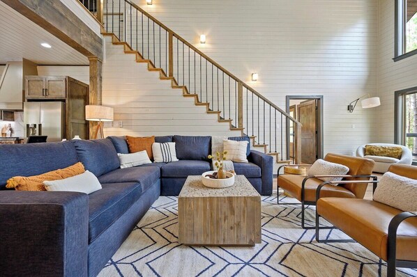 The spacious living area has plenty of natural light and ample seating
