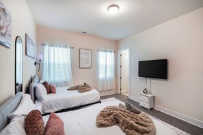 This room offers 2 full-size beds. It also includes a walk-in.
