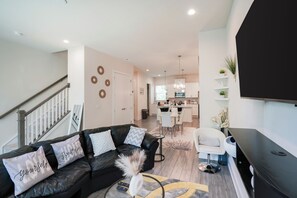 Open concept layout, seamlessly connecting with the dining and kitchen area.
