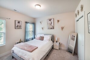 This room has a walk-in closet that includes a queen air mattress.