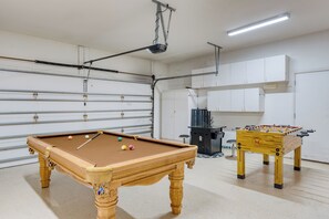 A pool table, a foosball table, and a classic cabinet-style Frogger video game are all available for your entertainment.