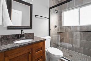 One of our three full bathrooms- newly renovated beautiful walk-in shower with new tiles and glass door!