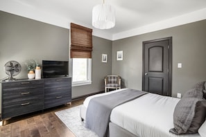 Guest Bedroom 1 - Modern and chic, rest peacefully each evening on a comfortable mattress and soft linens.