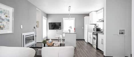 Our living room includes modern design, high-speed internet, and plush chairs!