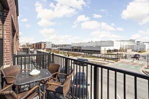 Enjoy fresh air outside on the balcony observing the view of the Speedway!
