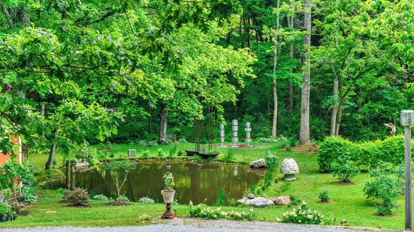 Views of the pond and sculpture garden from the back porch.