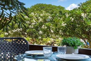 Fragrant Plumeria trees and a garden view from the patio