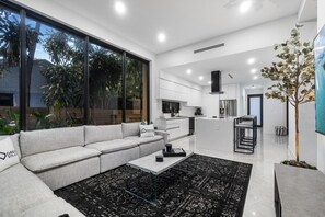 Interact with your group in the living room while cooking meals in the kitchen.
