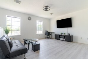 Furniture, Indoors, Living Room, Screen, Chair
