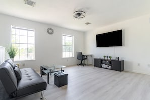 Furniture, Indoors, Living Room, Screen, Chair