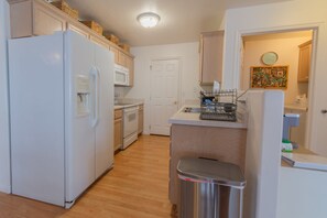 Indoors, Floor, Flooring, Refrigerator, Kitchen