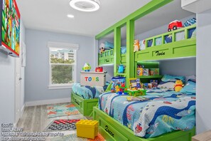 Our bunk room is a dream come true for kids. They’ll enjoy the soft beds and bright colors. It’s close to the shared bathroom, so you can check on them easily.