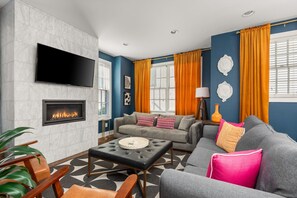 Bright and airy living room with ample seating and a welcoming atmosphere.