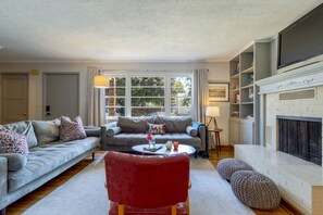 Large windows in living room with tons of natural, morning light! 