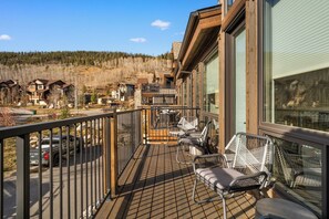 Spacious balcony with outdoor seating.